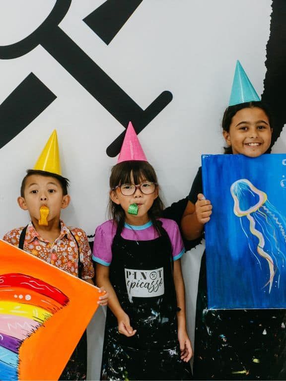 Kids having a party at Pinot & Picasso with their painted artworks